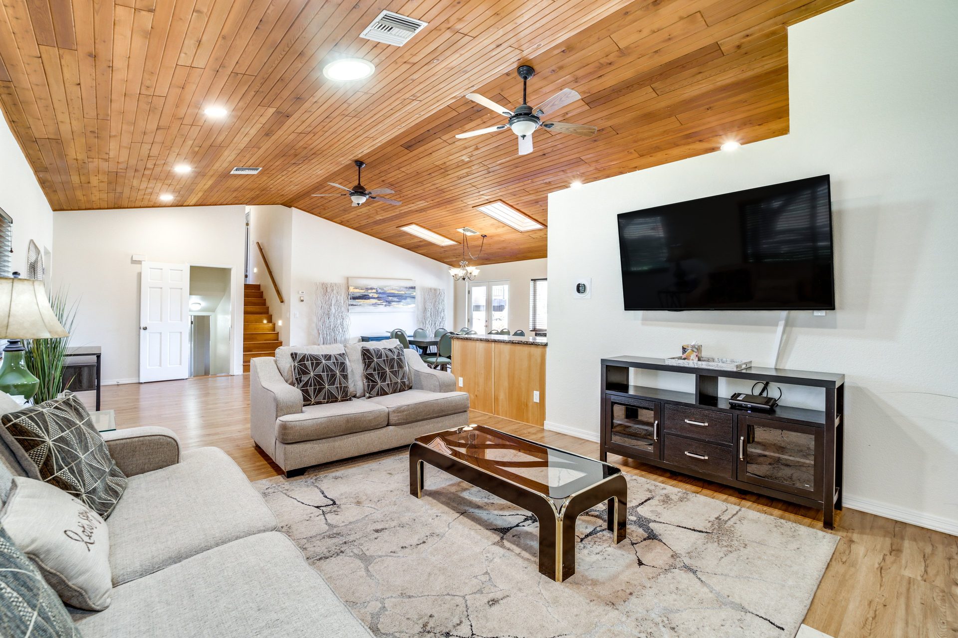 Open-plan living room with comfortable seating and natural light