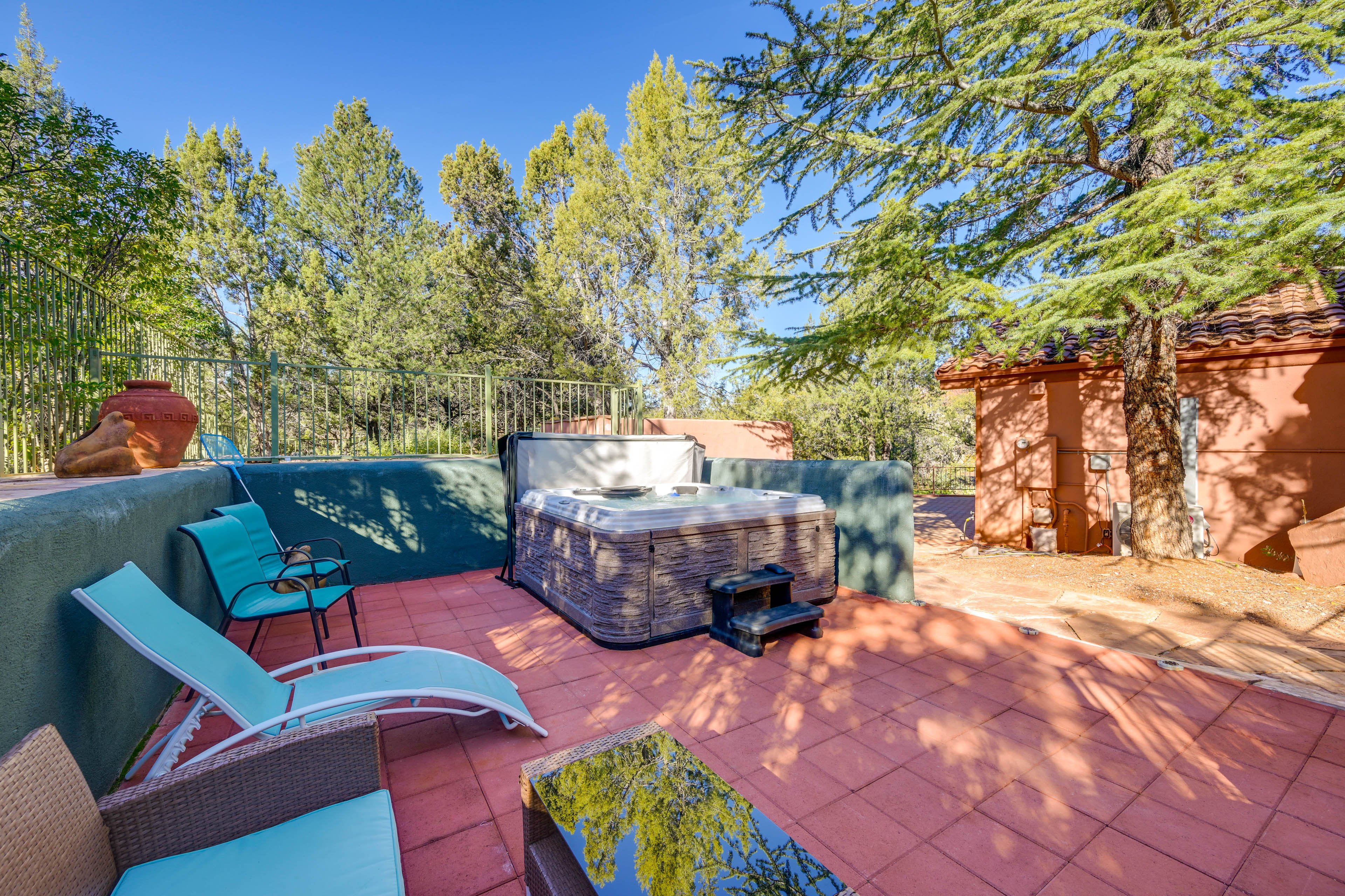 Private hot tub on red tile patio