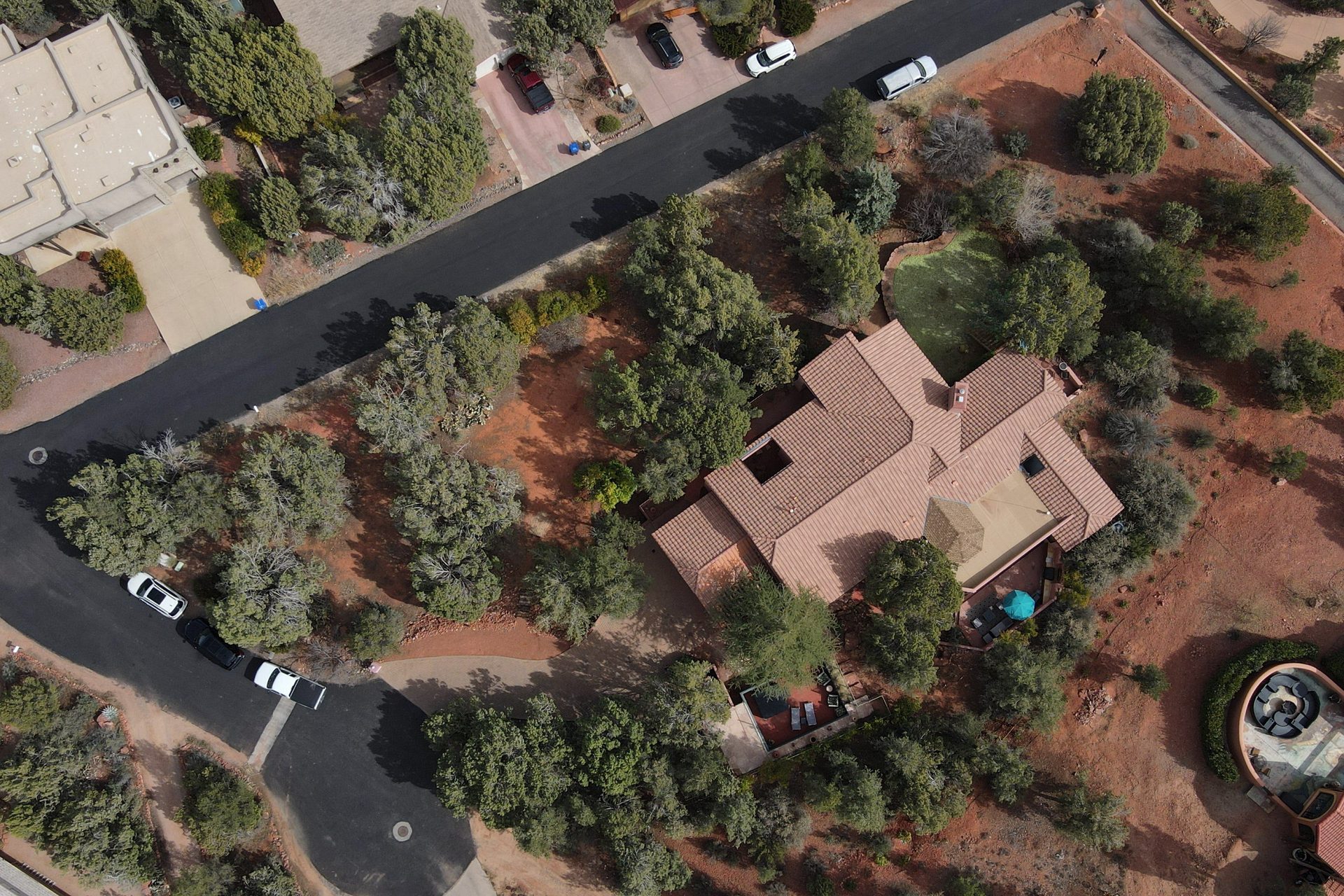 Aerial drone view of West Sedona property nestled among trees