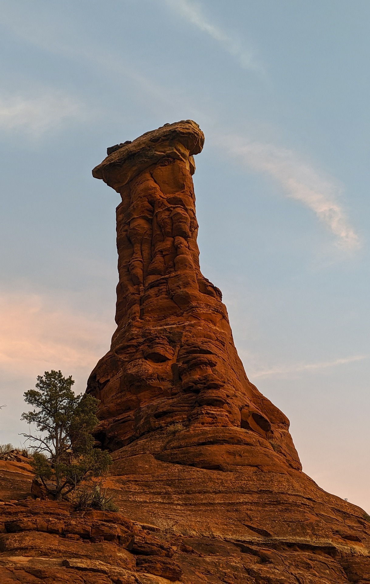 Sedona hoodoo spire glowing at sunset golden hour